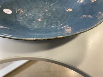 A Chinese monochrome blue Swatow dish with incised carp design, Ming